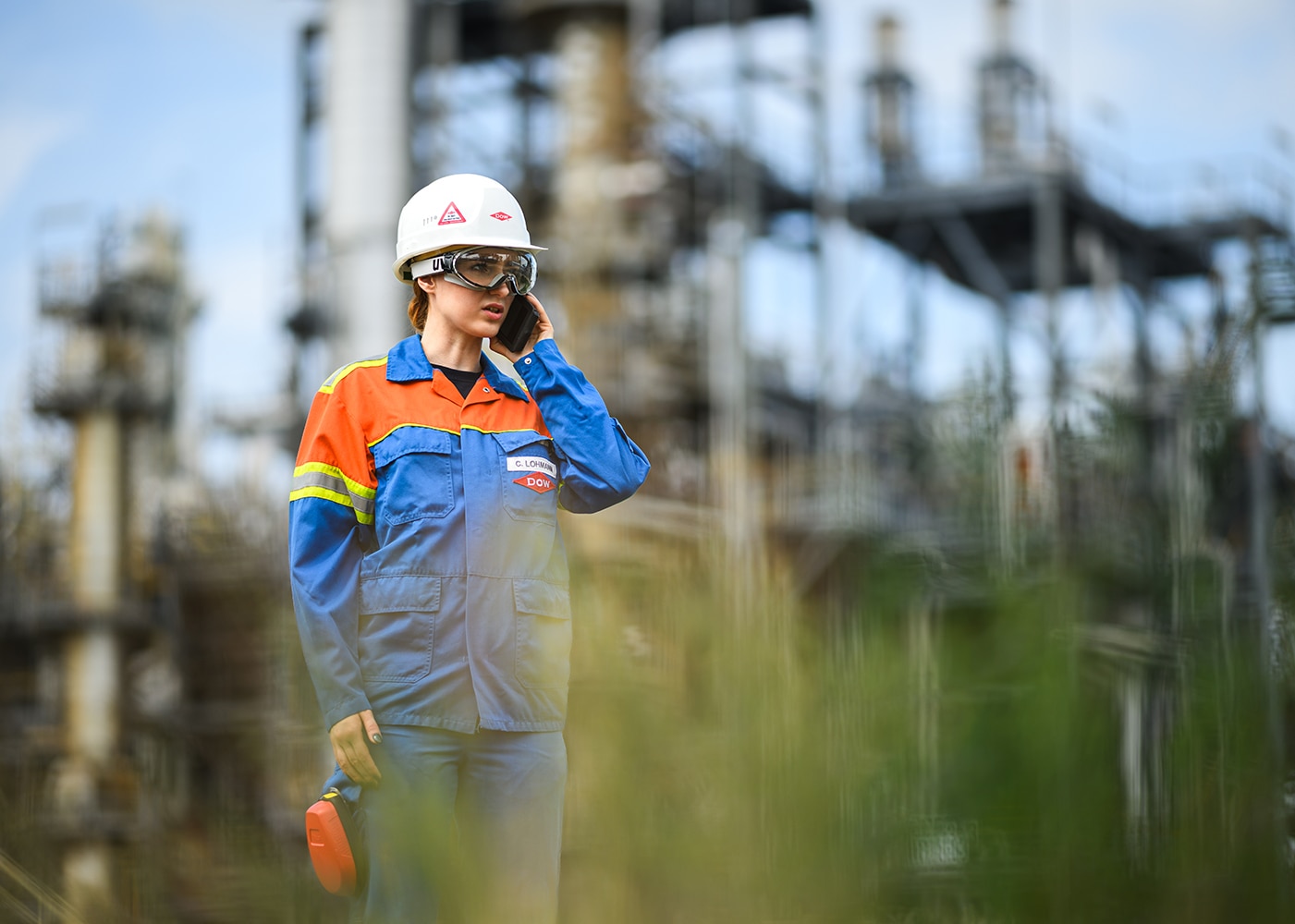 female on phone at factory