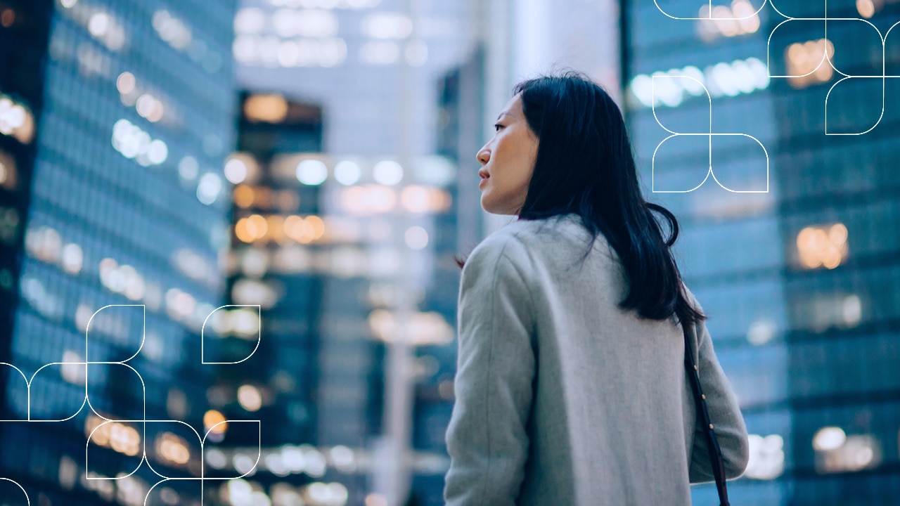 K2025 Solutions Spotlights Banner | Woman looking up at city lights | 1280x720